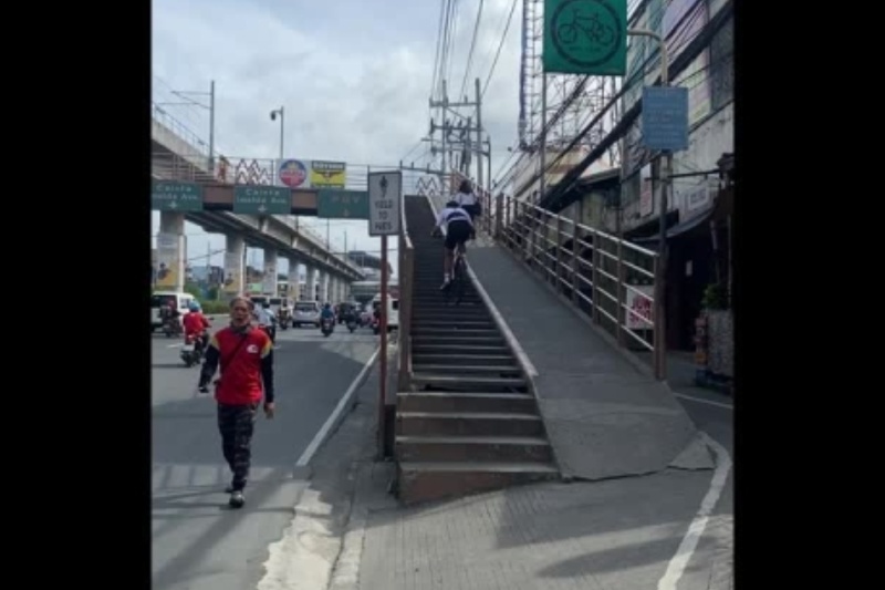 ‘Exhausting’: Cyclist rides up footbridge steps while oblivious woman walks on bike ramp in Rizal